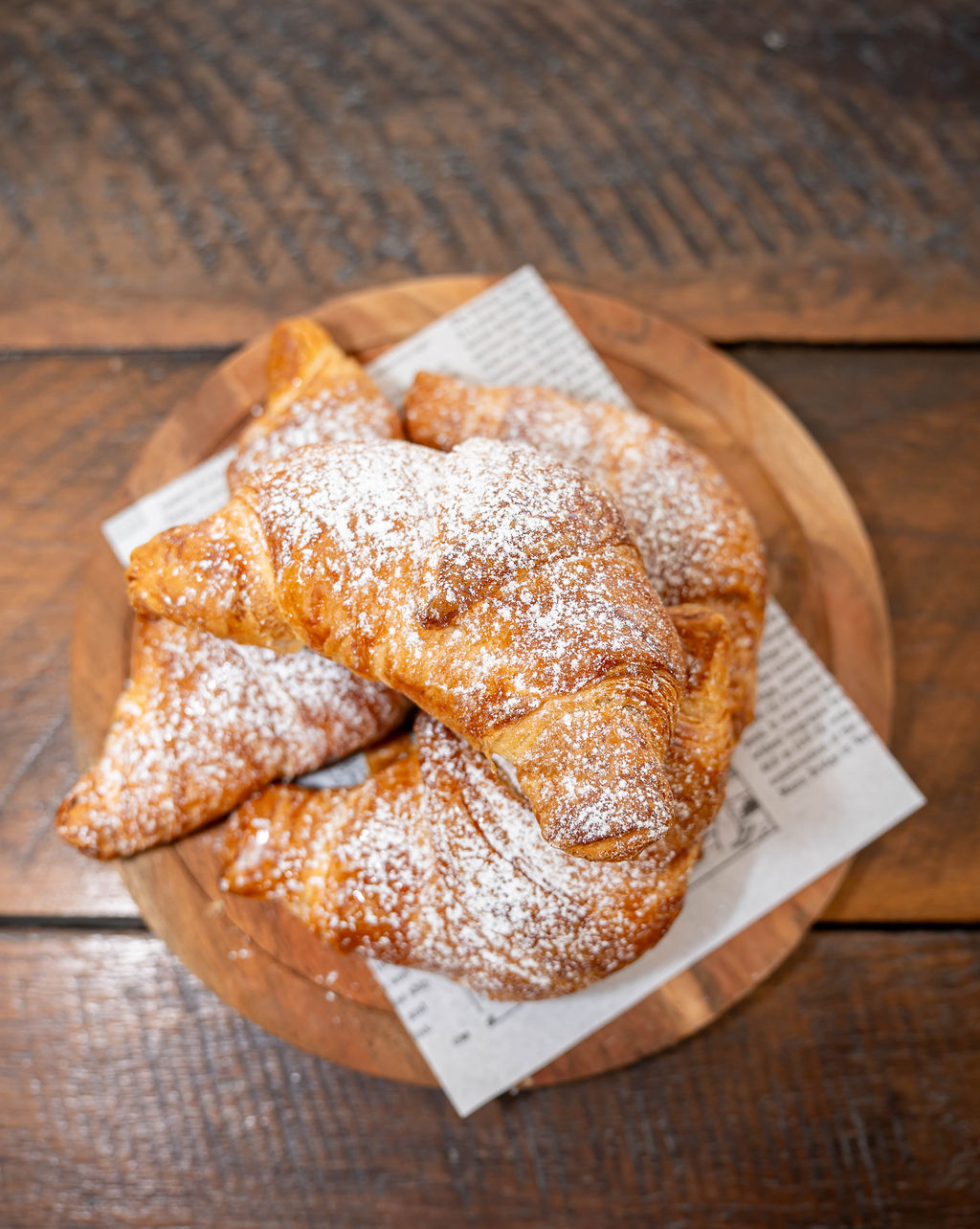 Fresh croissants on a board